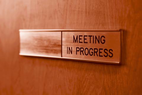 Meeting in Progress sign