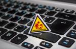 Caution sign on a laptop keyboard