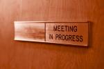 Meeting in Progress sign