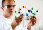 Man with molecular model