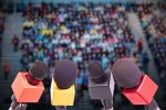 Microphones in front of a crowd
